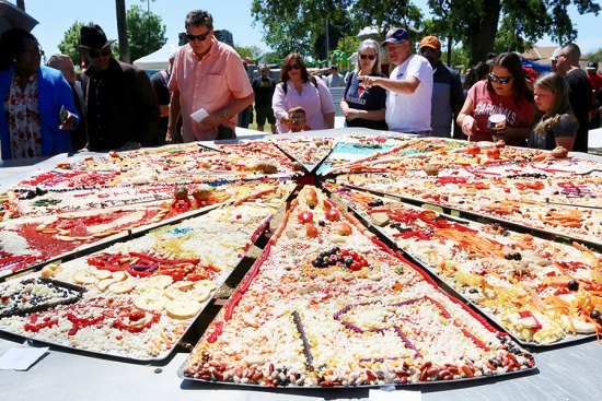 Pizza-building contest from 2019 Pizzafest. The event returns to Veterans Park on April 22, 23, 24.